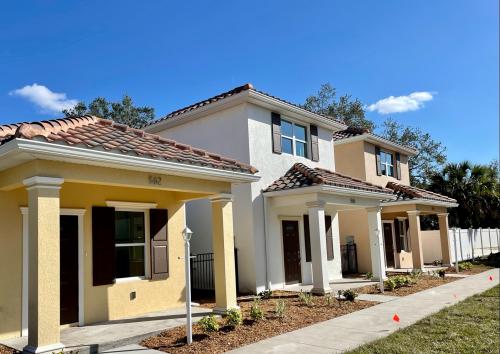 Three houses side by side, outdoors.